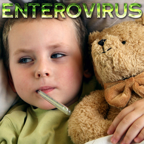 Boy laying in bed hugging a teddy bear with a thermometer in his mouth.