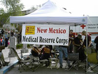 Photo of MRC Tent and volunteers at event.